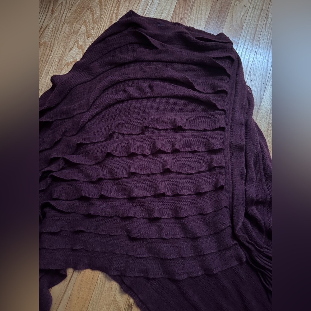 Woman’s burgundy knit poncho